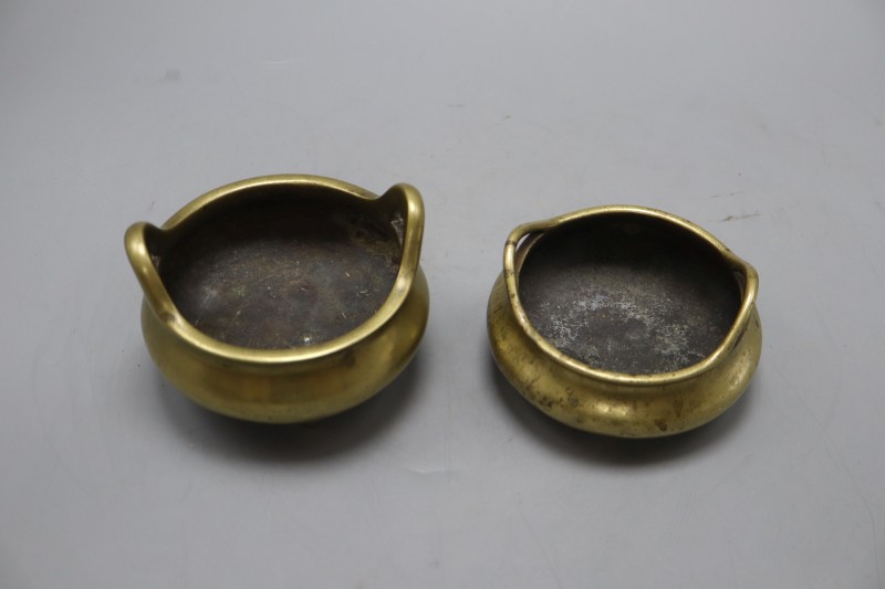 Two Chinese bronze tripod censers with seal marks, tallest 9cm